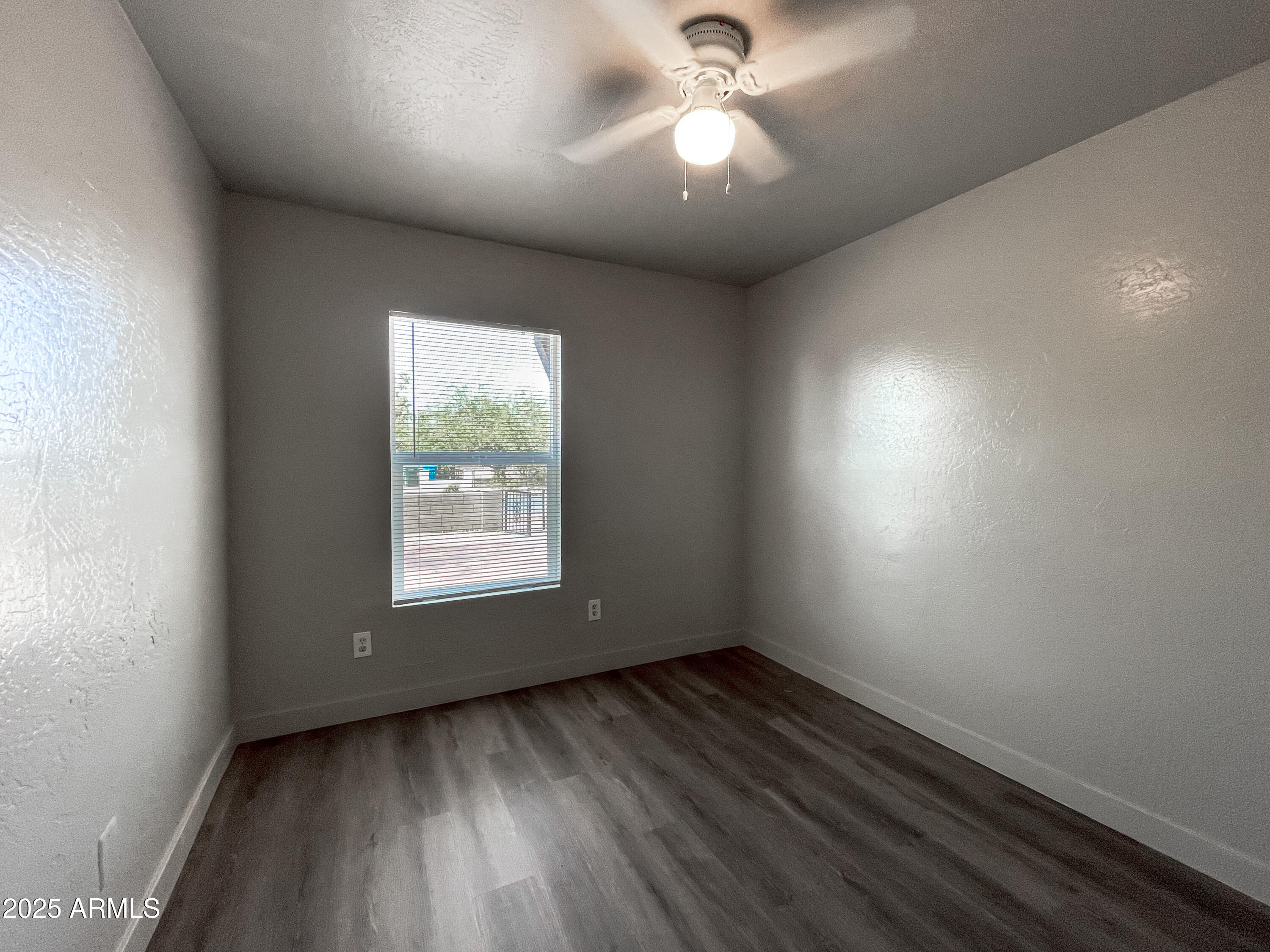 1421 East Fillmore Street, Unit 4 Phoenix, AZ 85006 - Photo 16 of 18 an empty room with a window
