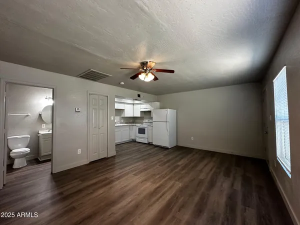 a view of a livingroom with a kitchen