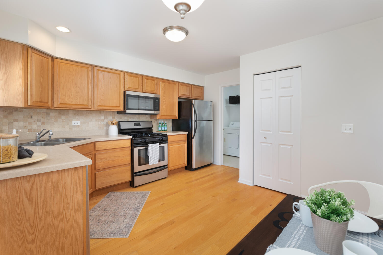 31 Rolling Oaks Road, Unit A Sugar Grove, IL 60554 - Photo 12 of 25 a kitchen with stainless steel appliances granite countertop a refrigerator sink and microwave