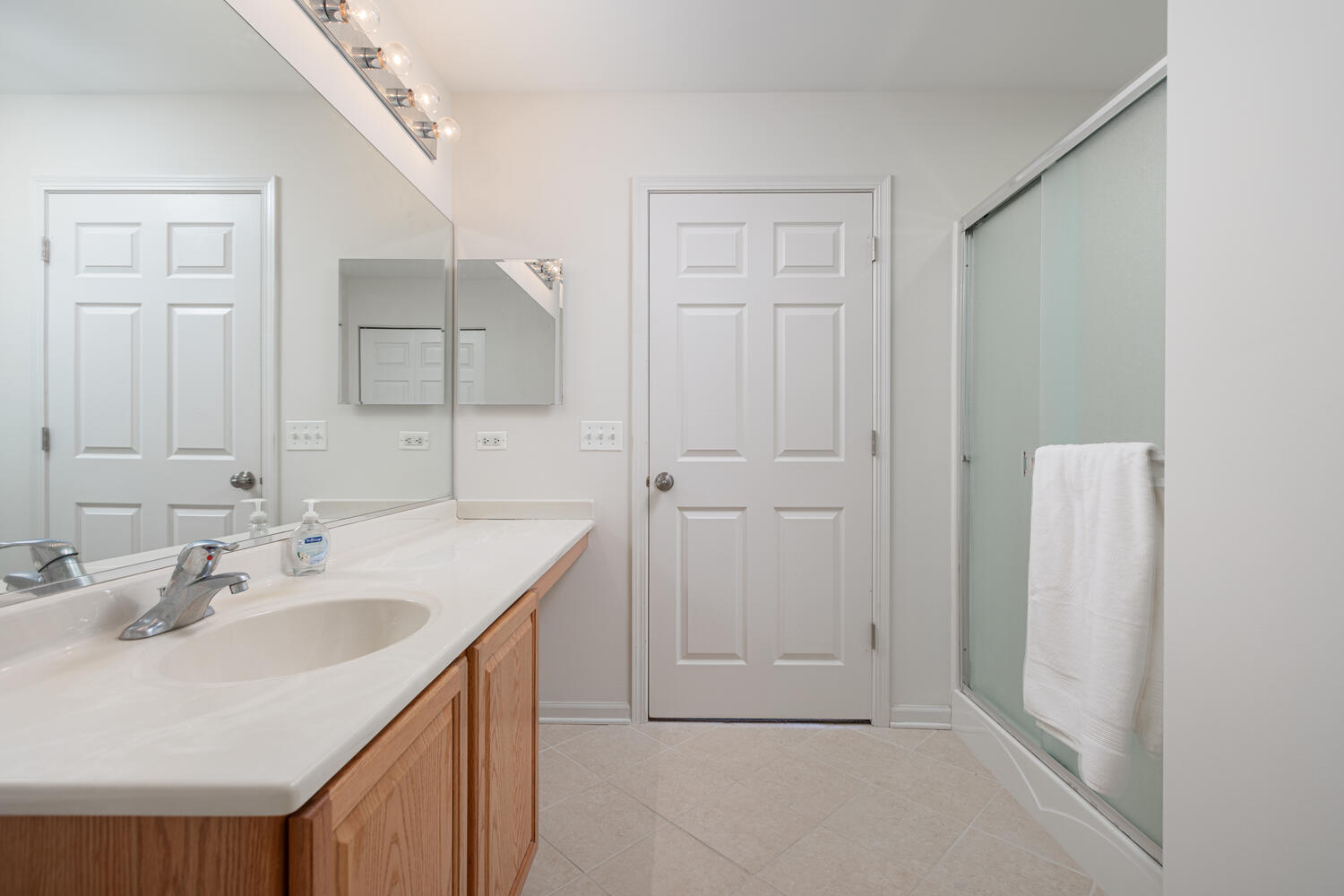 31 Rolling Oaks Road, Unit A Sugar Grove, IL 60554 - Photo 16 of 25 a bathroom with a sink and a mirror