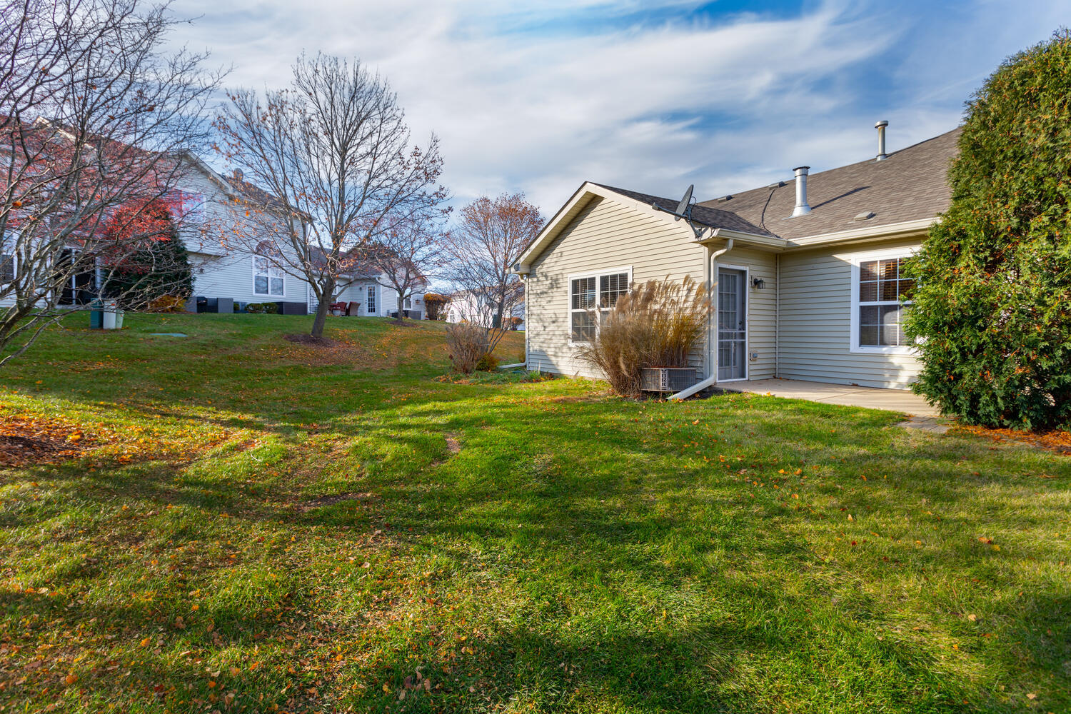 31 Rolling Oaks Road, Unit A Sugar Grove, IL 60554 - Photo 25 of 25 a view of a house with a yard and sitting area
