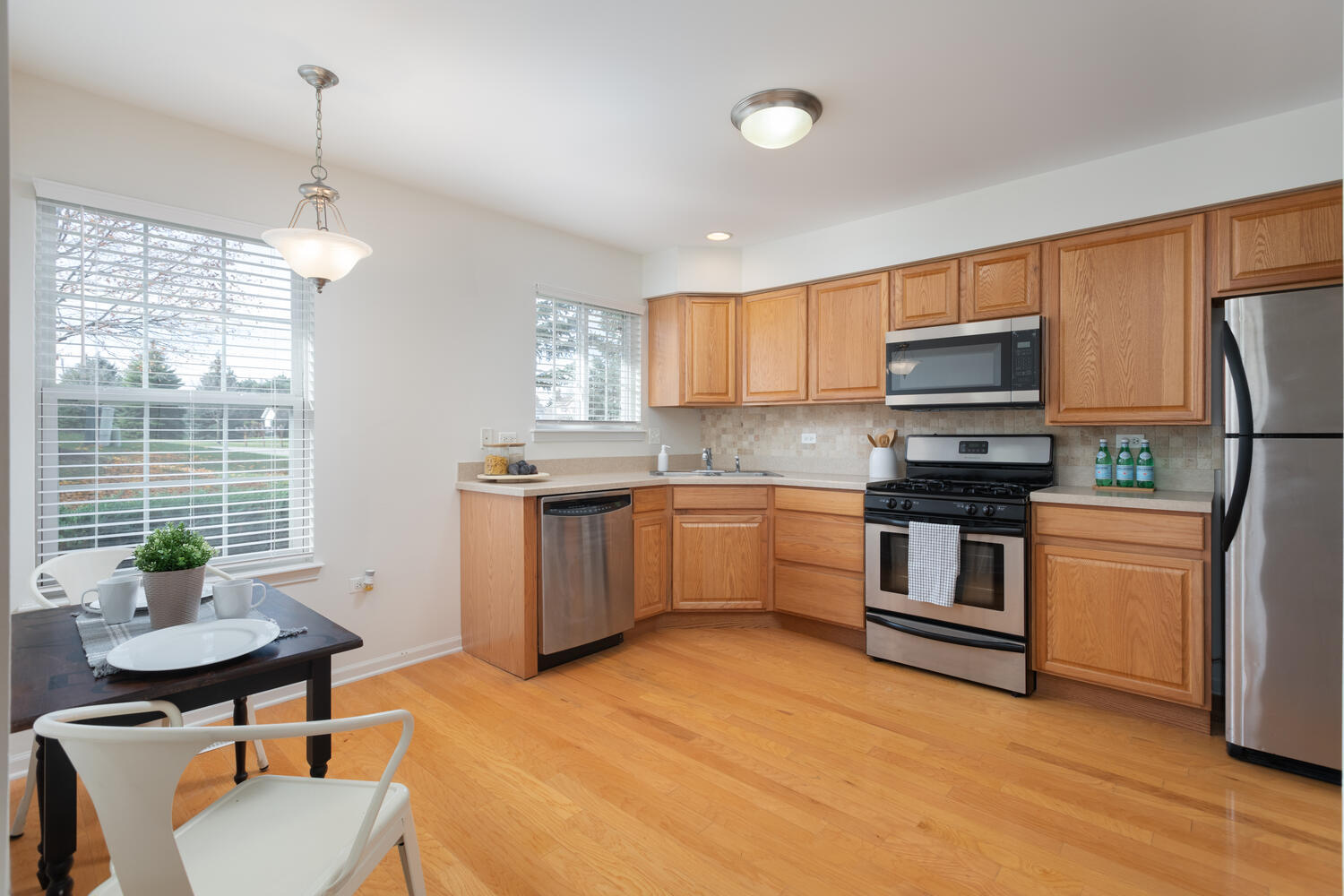 31 Rolling Oaks Road, Unit A Sugar Grove, IL 60554 - Photo 10 of 25 a kitchen with a sink appliances cabinets and furniture
