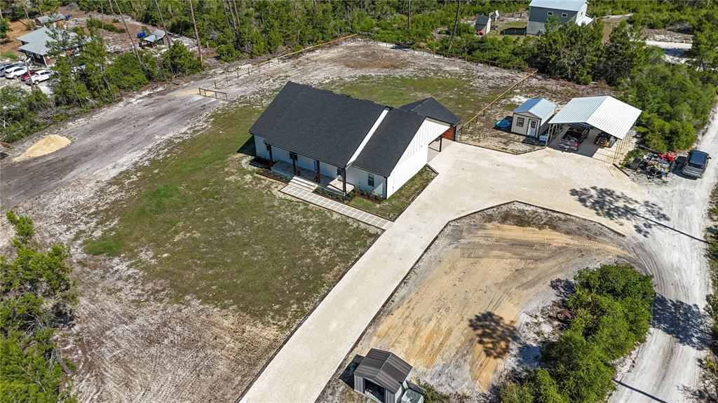 7890 Southwest 129th Avenue Cedar Key, FL 32625 - Photo 41 of 45 an aerial view of a house with a yard