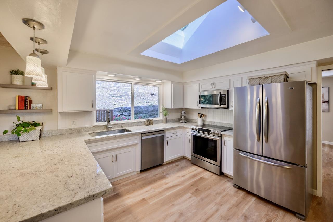 155 Rabbits Run Road Santa Cruz, CA 95060 - Photo 9 of 113 a kitchen with granite countertop stainless steel appliances a refrigerator sink and microwave