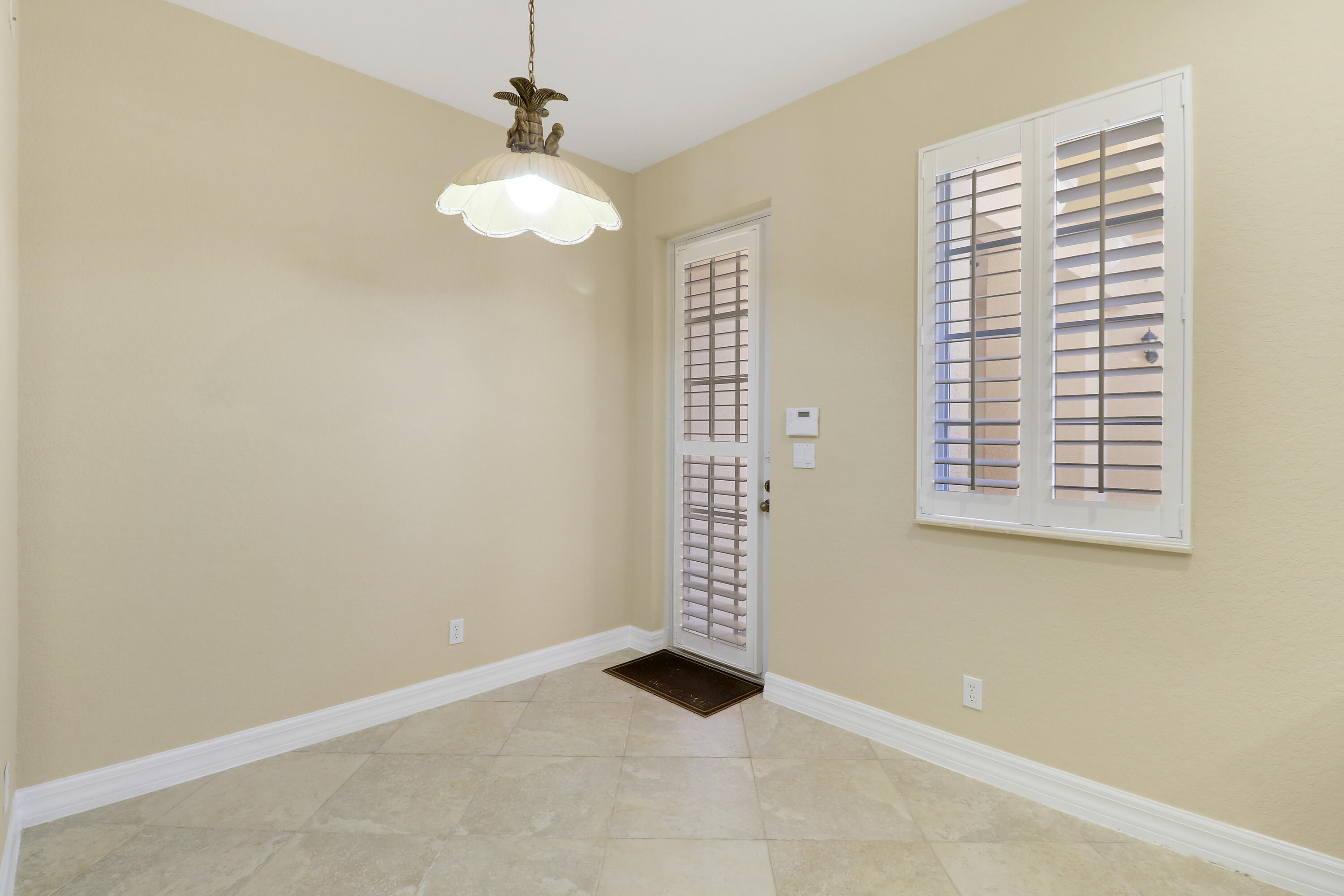 138 Tallow Trail Jupiter, FL 33458 - Photo 12 of 38 a view of an empty room with a window