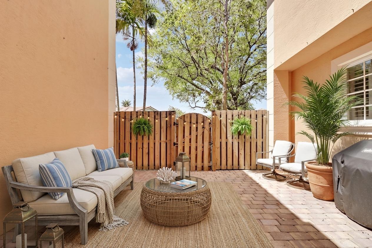 138 Tallow Trail Jupiter, FL 33458 - Photo 13 of 38 a outdoor living space with furniture and a potted plant