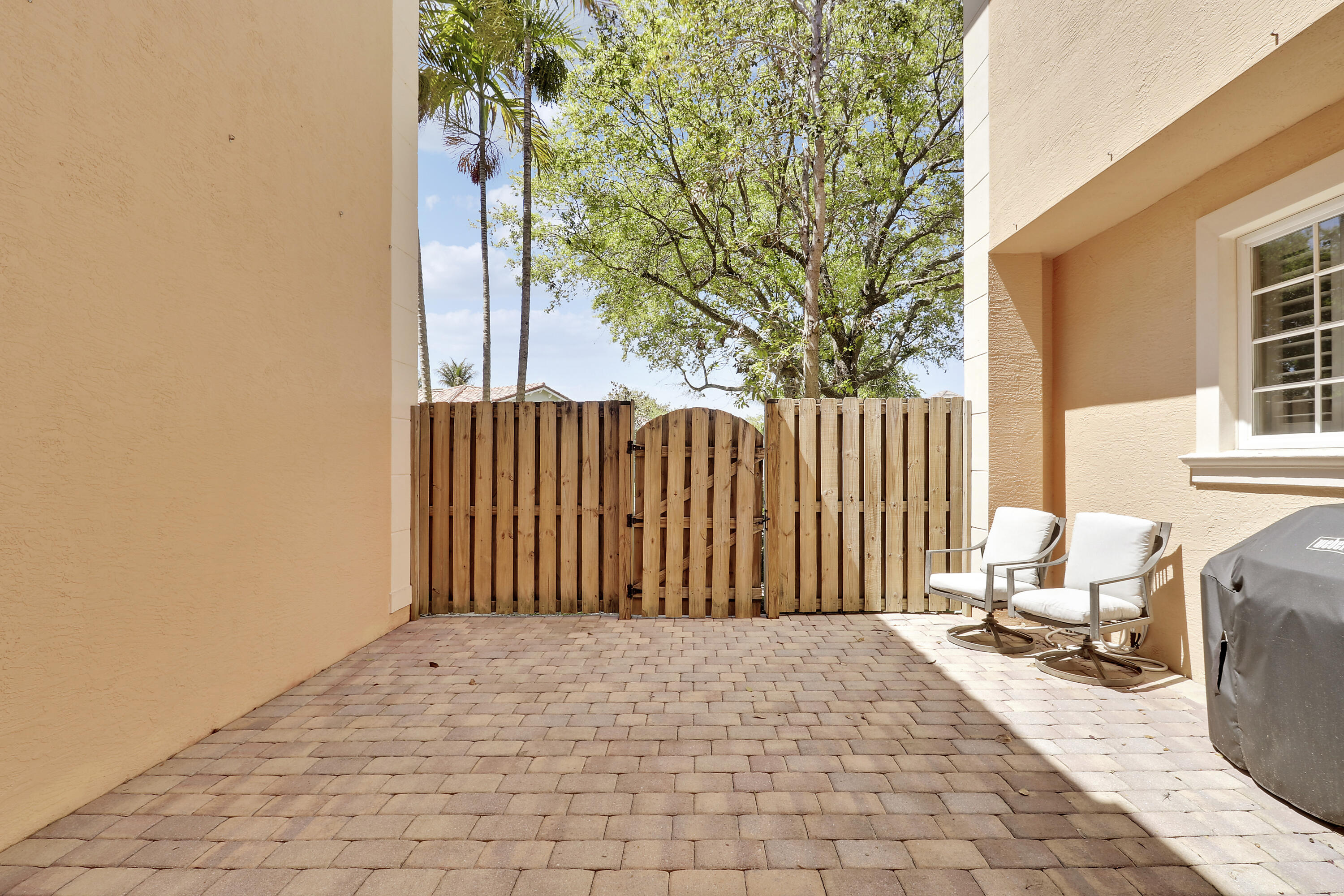 138 Tallow Trail Jupiter, FL 33458 - Photo 14 of 38 a view of outdoor space with garden and patio