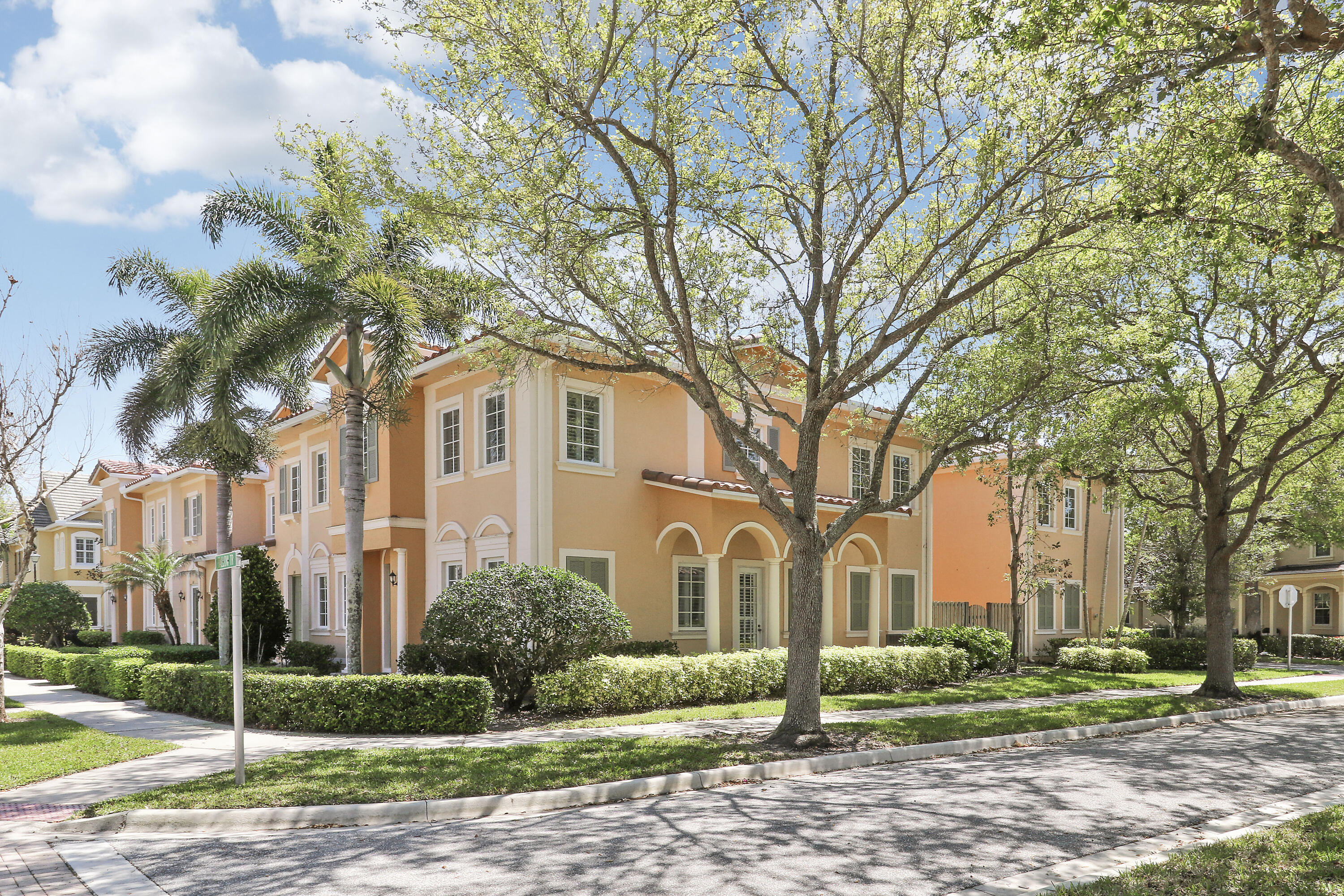 138 Tallow Trail Jupiter, FL 33458 - Photo 34 of 38 a front view of a house with a yard and trees