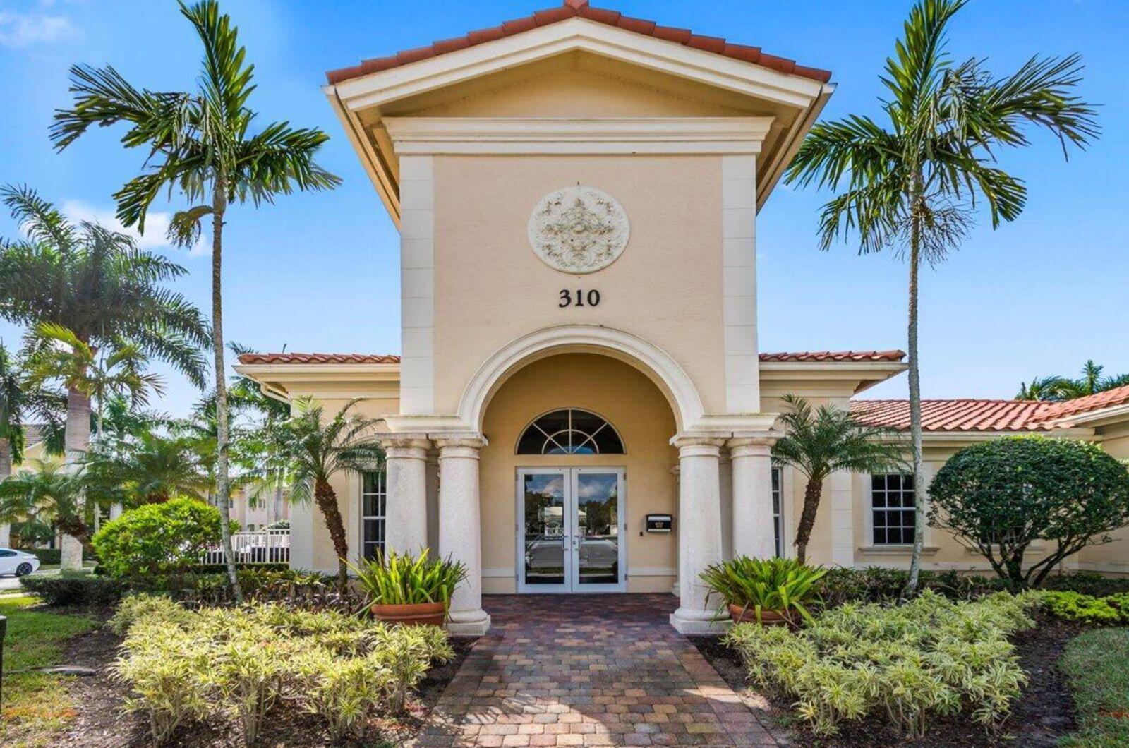 138 Tallow Trail Jupiter, FL 33458 - Photo 35 of 38 a front view of a house with garden