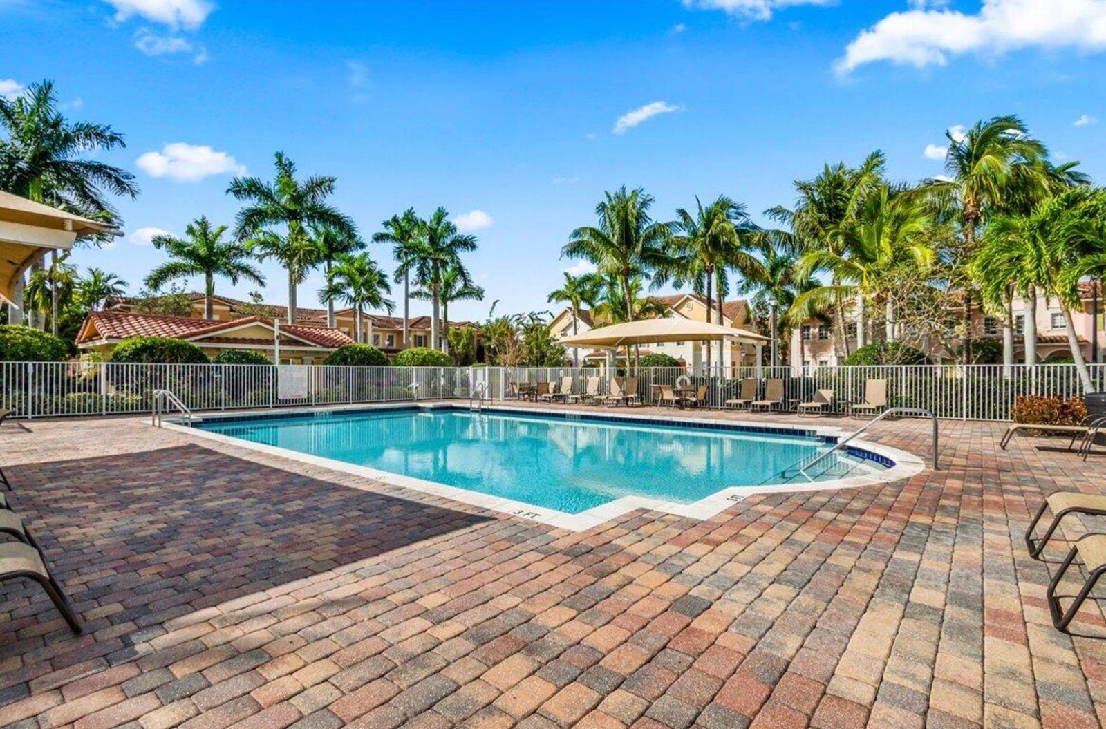 138 Tallow Trail Jupiter, FL 33458 - Photo 36 of 38 a view of a swimming pool with an outdoor space