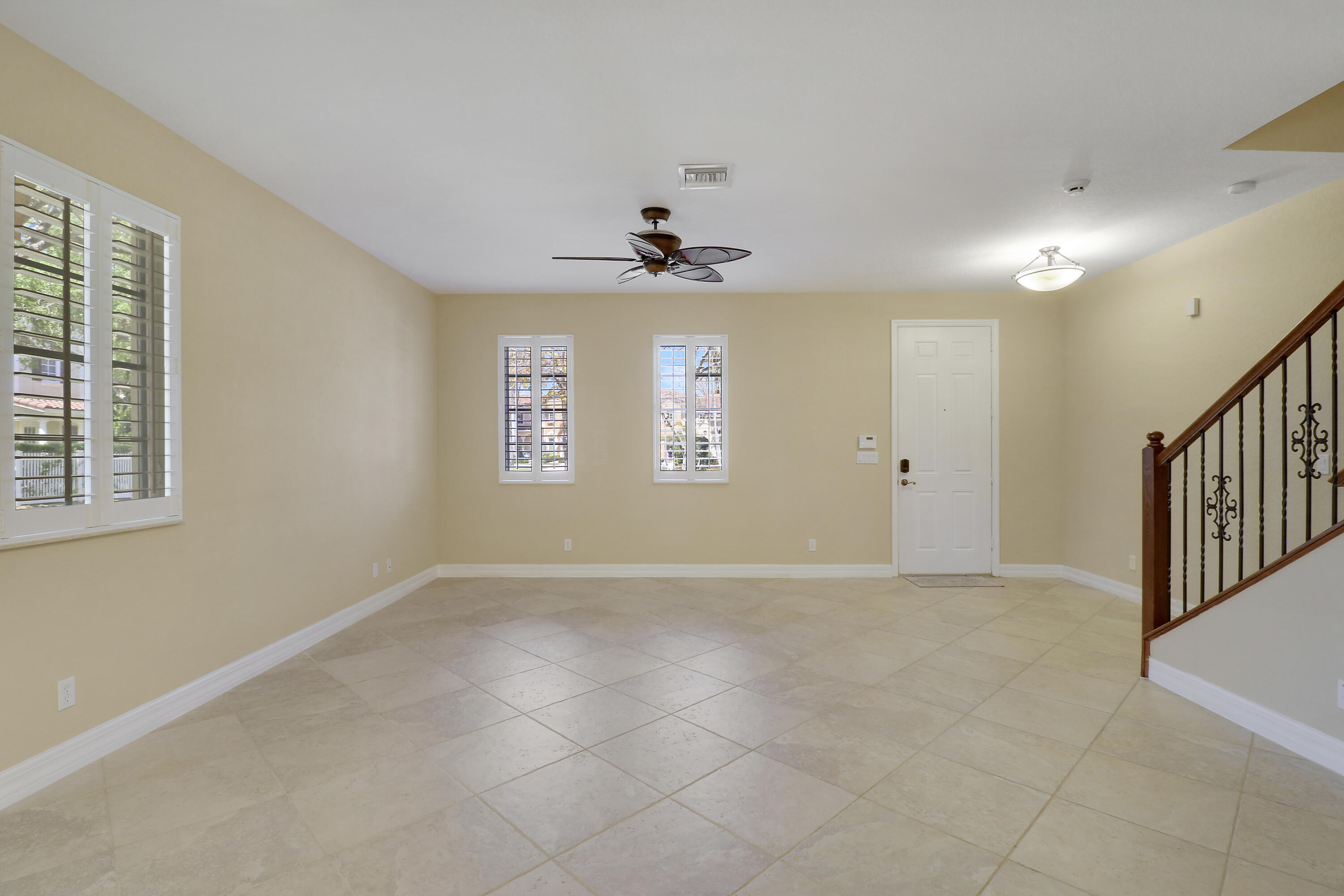 138 Tallow Trail Jupiter, FL 33458 - Photo 5 of 38 a view of an empty room with a window