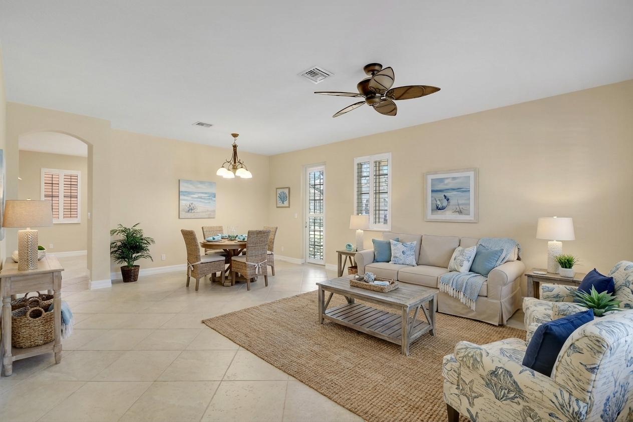 138 Tallow Trail Jupiter, FL 33458 - Photo 6 of 38 a living room with furniture and a chandelier