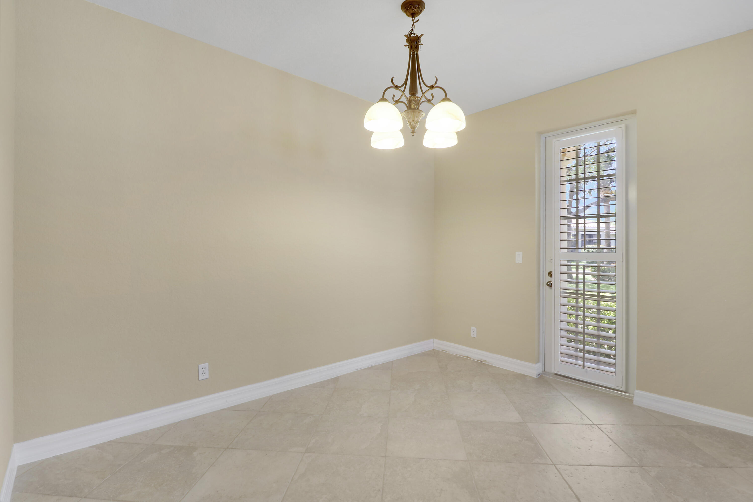 138 Tallow Trail Jupiter, FL 33458 - Photo 8 of 38 dining room door to side porch