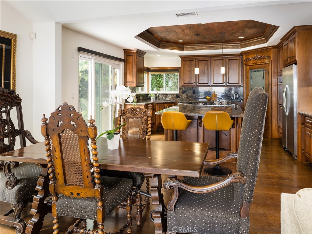 8 Stallion Road Rancho Palos Verdes, CA 90275 - Photo 15 of 56 a view of a dining room with furniture and wooden floor