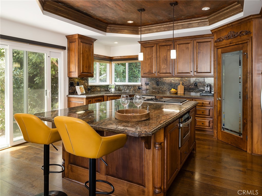 8 Stallion Road Rancho Palos Verdes, CA 90275 - Photo 16 of 56 a kitchen with granite countertop a sink and chairs