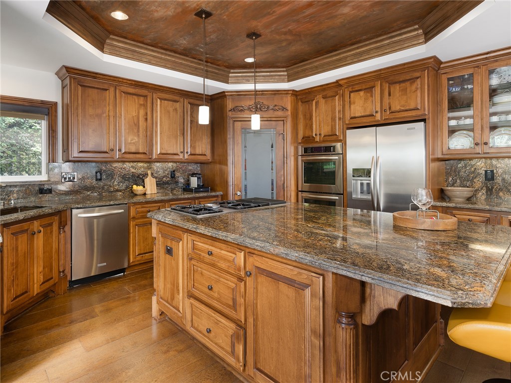 8 Stallion Road Rancho Palos Verdes, CA 90275 - Photo 18 of 56 a kitchen with stainless steel appliances granite countertop a sink a stove and a refrigerator