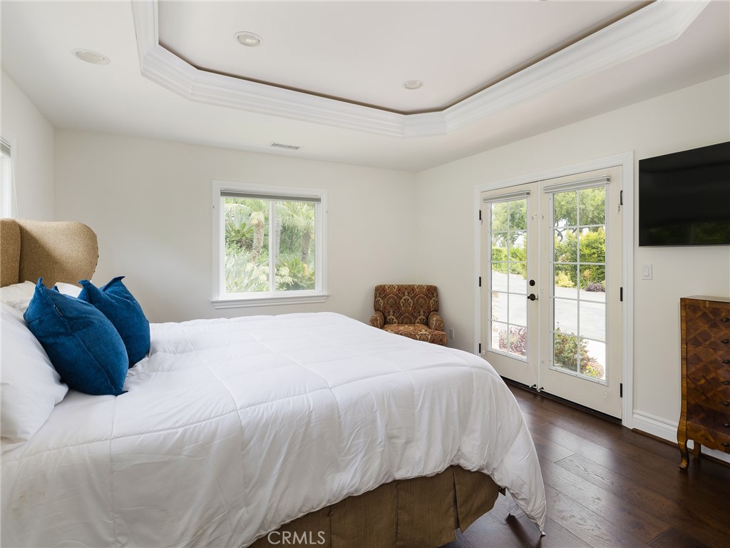 8 Stallion Road Rancho Palos Verdes, CA 90275 - Photo 21 of 56 a bedroom with a bed and tv