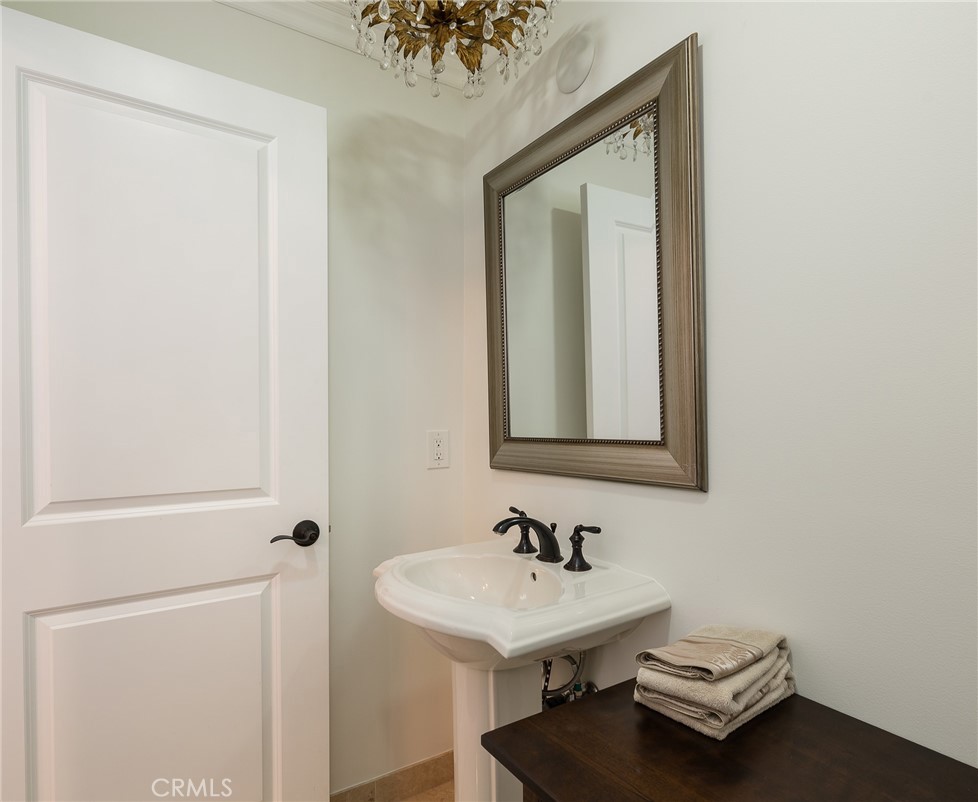 8 Stallion Road Rancho Palos Verdes, CA 90275 - Photo 35 of 56 a bathroom with a sink a mirror and shower