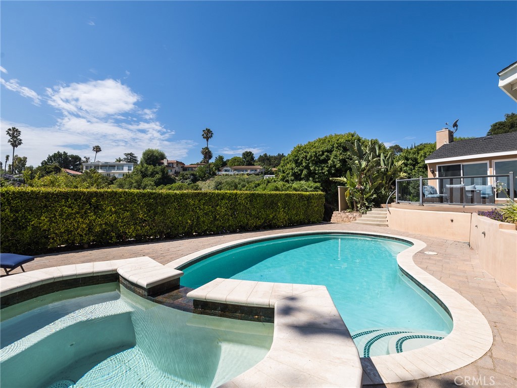 8 Stallion Road Rancho Palos Verdes, CA 90275 - Photo 39 of 56 a view of a swimming pool with a yard