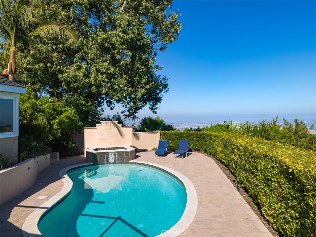 8 Stallion Road Rancho Palos Verdes, CA 90275 - Photo 41 of 56 a view of a swimming pool with a patio