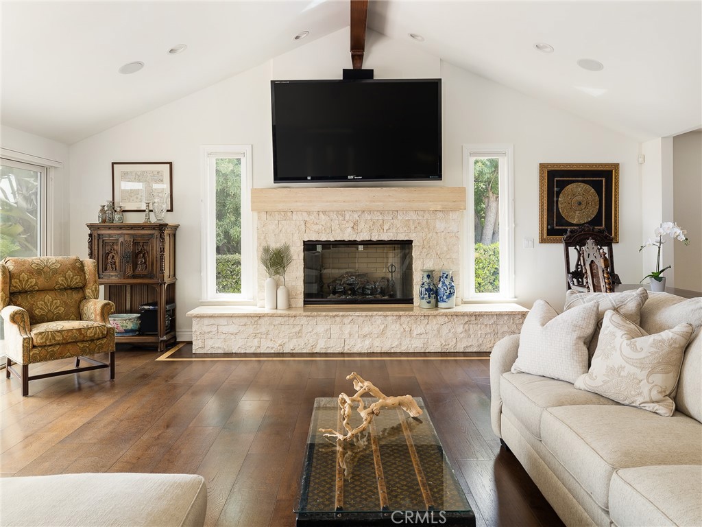 8 Stallion Road Rancho Palos Verdes, CA 90275 - Photo 8 of 56 a living room with furniture a fireplace and a flat screen tv