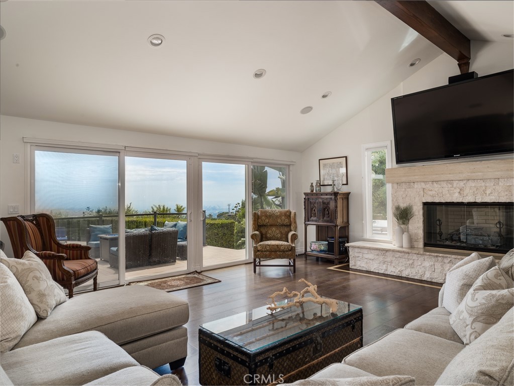 8 Stallion Road Rancho Palos Verdes, CA 90275 - Photo 10 of 56 a living room with furniture fireplace and flat screen tv