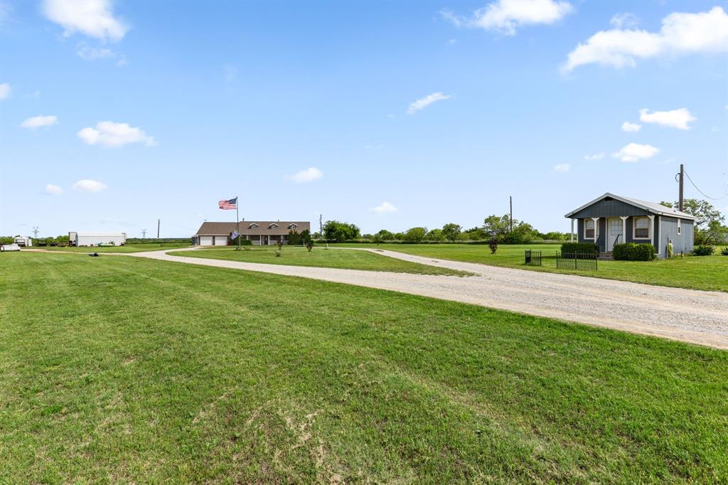 13315 Highway 281 Scotland, TX 76379 - Photo 2 of 40 Ranch style house featuring expansive yard, circular drive, 20 X 30 shop and extra living space.