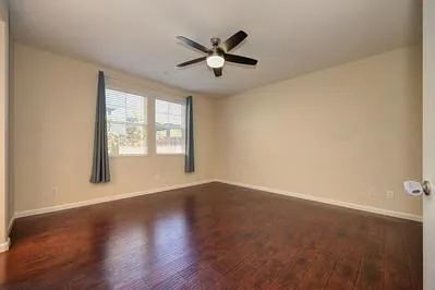 a bathroom with a tub a sink and mirror