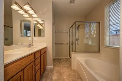 a bathroom with a bathtub and a shower
