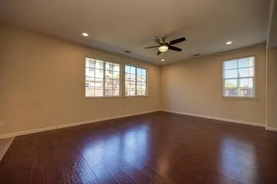 a view of a kitchen with a sink and wooden floor