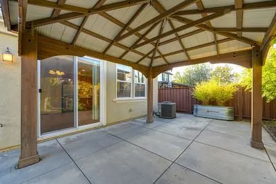 a view of a house with backyard and garden