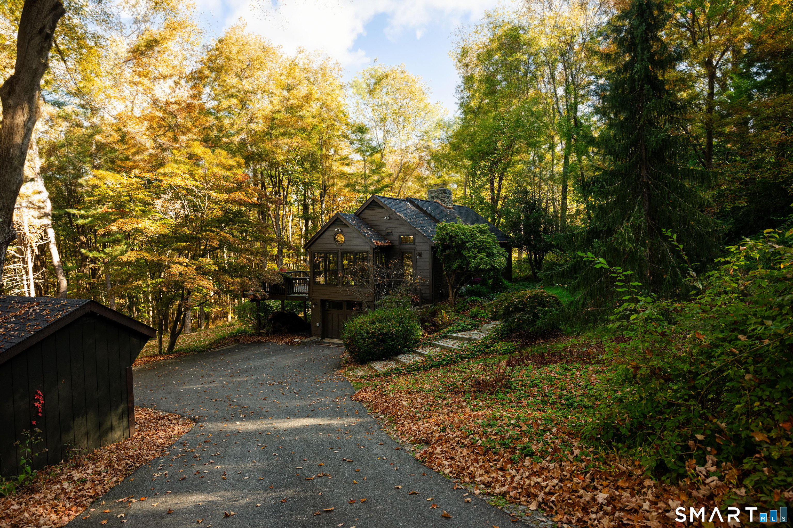 45 Big Trail Sherman, CT 06784 - Photo 1 of 36 a front view of a house with garden