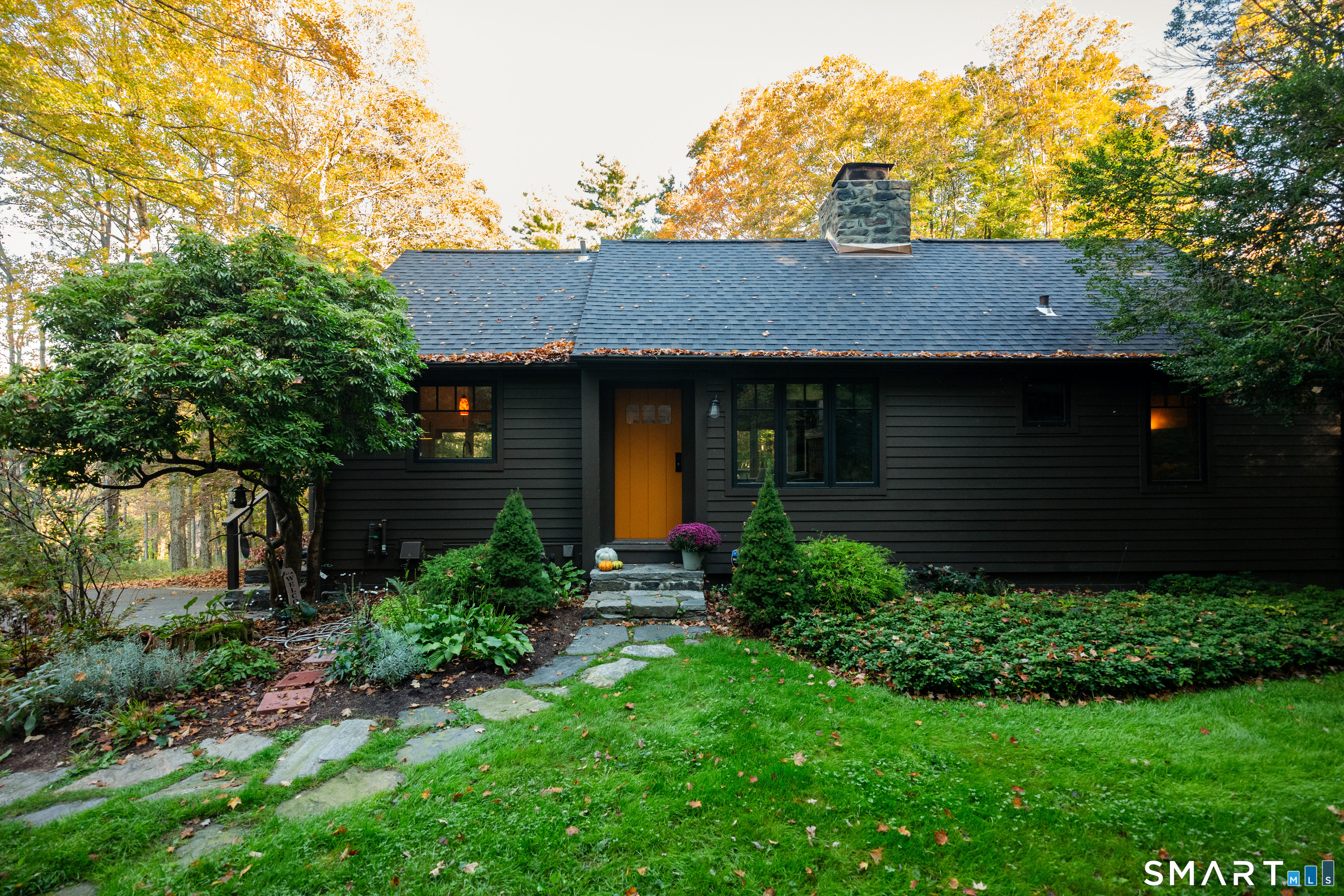 45 Big Trail Sherman, CT 06784 - Photo 35 of 36 a front view of a house with garden