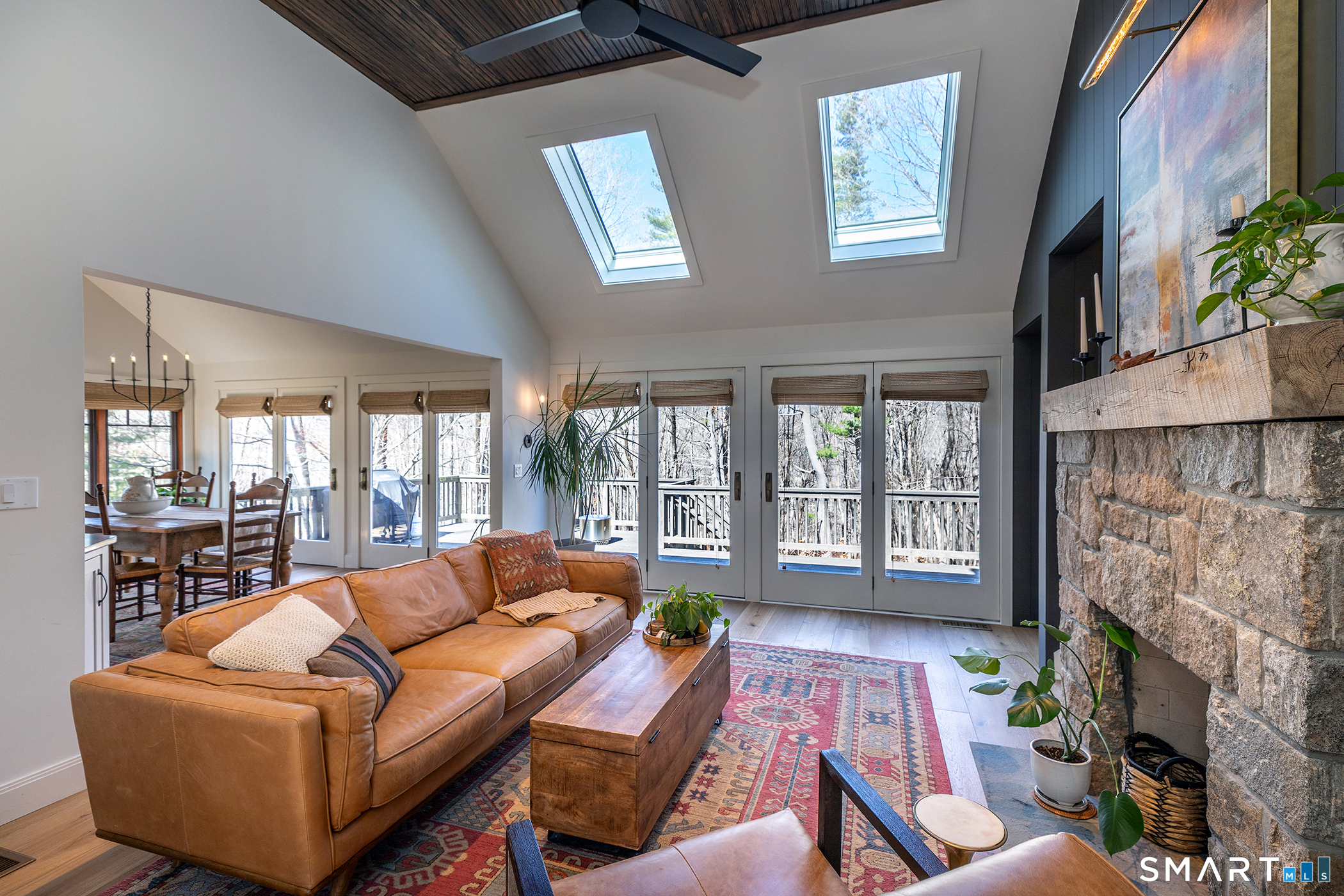 45 Big Trail Sherman, CT 06784 - Photo 9 of 36 a living room with fireplace furniture and a floor to ceiling window