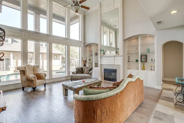 a living room with furniture and a fireplace