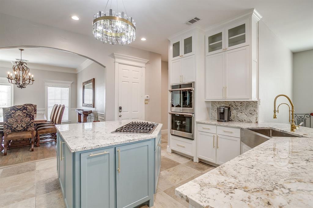 253 Bayne Road Haslet, TX 76052 - Photo 16 of 40 a view of living room kitchen island stainless steel appliances wooden floor and living room view
