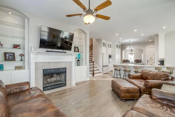 a living room with furniture fireplace and flat screen tv