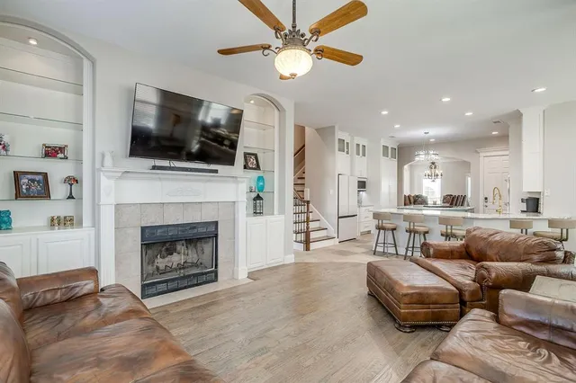 a living room with furniture fireplace and flat screen tv