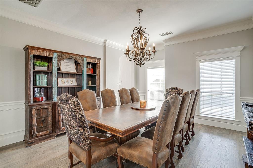 253 Bayne Road Haslet, TX 76052 - Photo 21 of 40 a view of a dining room with furniture window and wooden floor