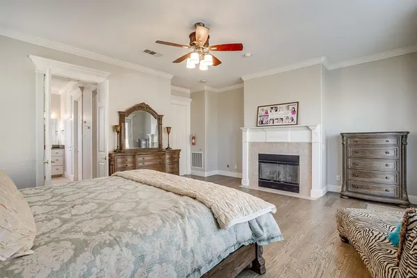a bedroom with a bed and a fireplace