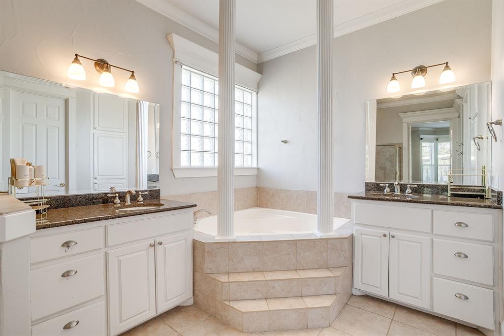 253 Bayne Road Haslet, TX 76052 - Photo 25 of 40 a bathroom with a granite countertop double vanity sink a mirror and a bathtub