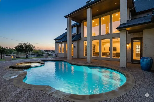 a view of a swimming pool with lounge chair