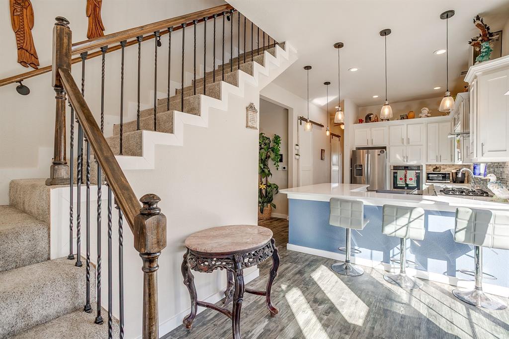 253 Bayne Road Haslet, TX 76052 - Photo 35 of 40 a view of kitchen with furniture and a chandelier