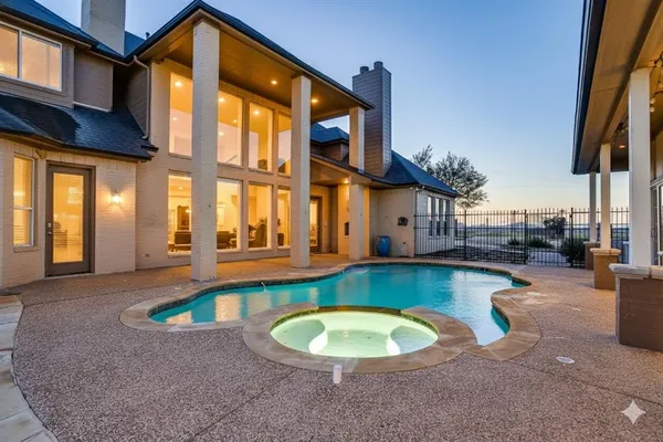 a view of a swimming pool with a lounge chairs