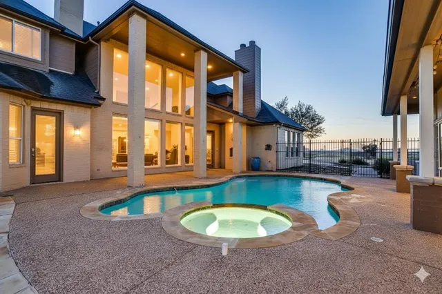 a view of a swimming pool with a lounge chairs
