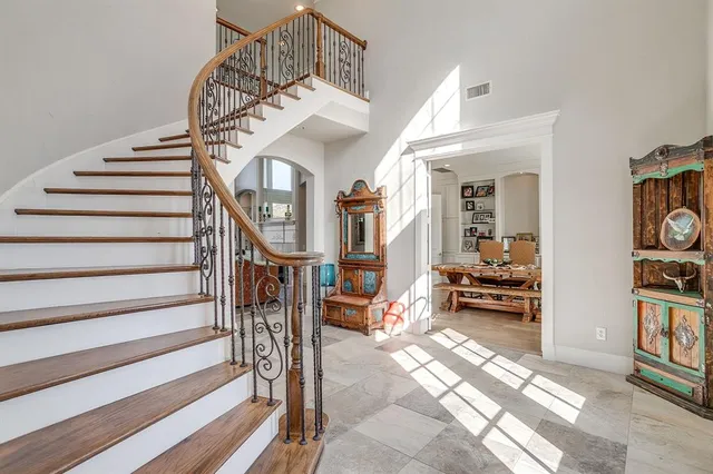 a view of entryway livingroom and hall with wooden floor