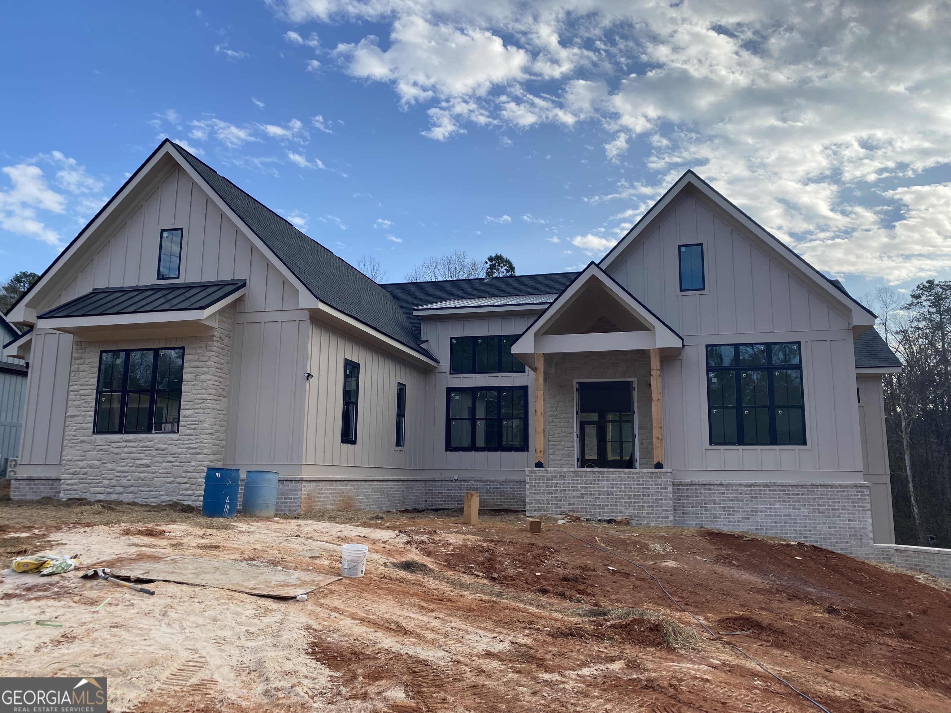 2476 Rockbridge Road Northwest, Unit LOT 18 Conyers, GA 30012 - Photo 4 of 5 a front view of a house with a yard and garage