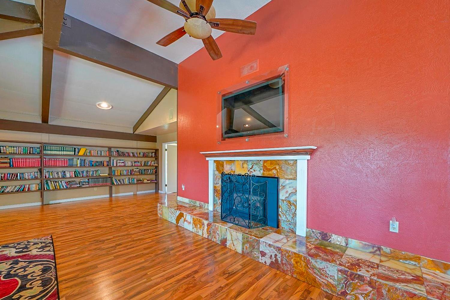 5015 Shooting Star Road Pollock Pines, CA 95726 - Photo 34 of 44 a view of an empty room with wooden floor and a fireplace