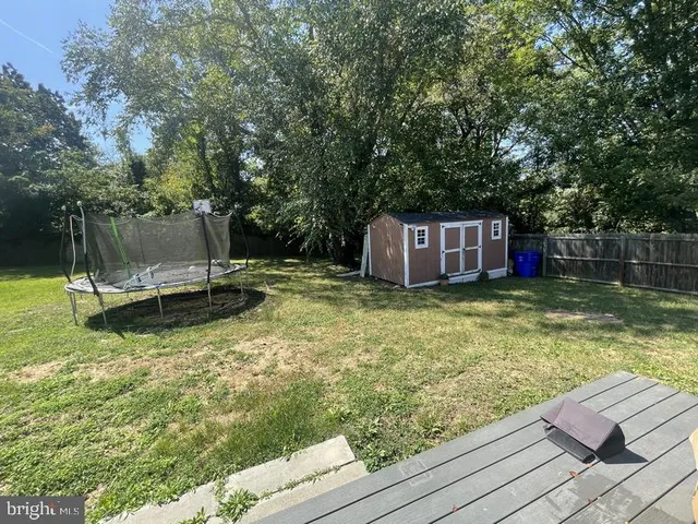 a view of a wooden deck with a bench