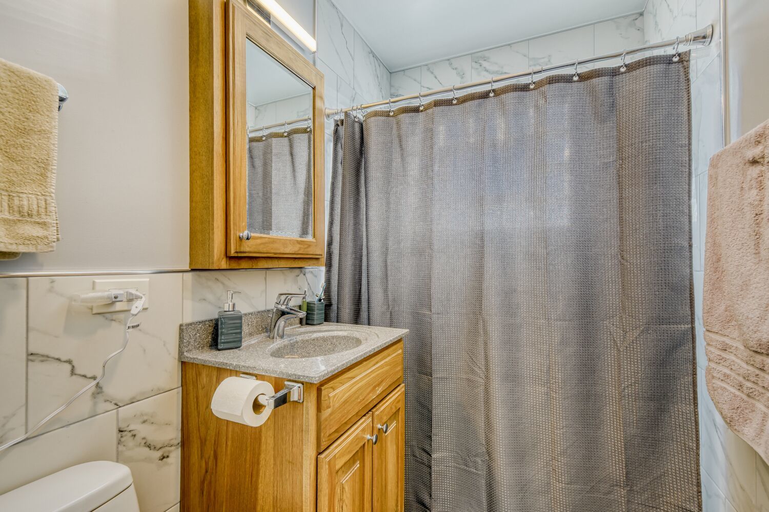 3643 West 113th Street Chicago, IL 60655 - Photo 11 of 19 a bathroom with a sink and a mirror